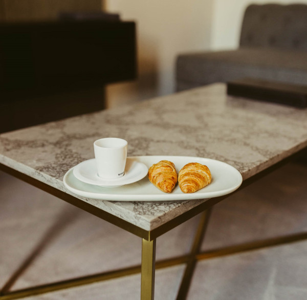 Cup of coffee with croissants at Deco Hotel