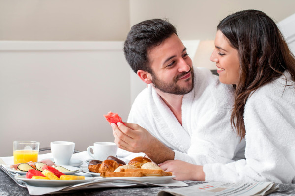 Couple enjoying breakfast at Deco Hotel